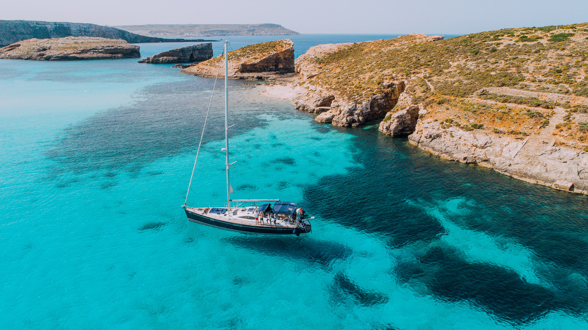 Aerial of Yacht in Blue Lagoon, off Comino_副本.jpg